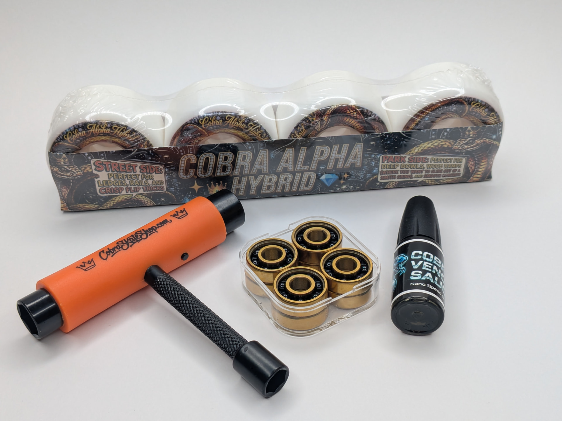 Cobra Loud Pack complete kit with Alpha Hybrid wheels, Gold Series ceramic bearings, Venom Sauce nano-oil, and free skate tool